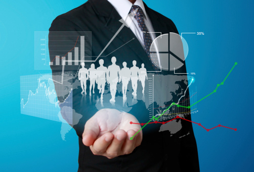 Man holding data on projections in his hand