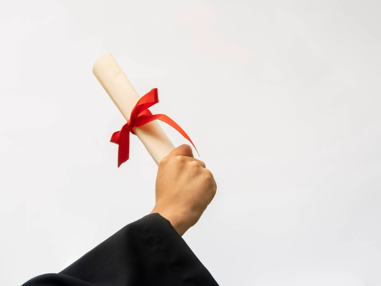 Hand extended holding a degree
