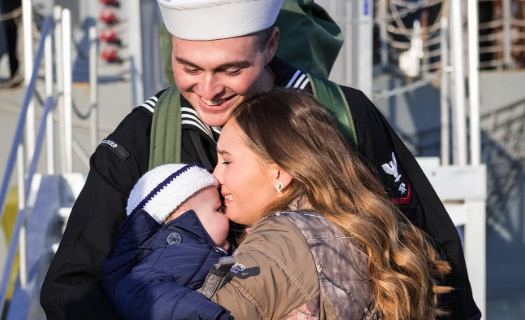 Military family reuniting. Image from Veteran and Spouse Transitional Assistance Grant Program.