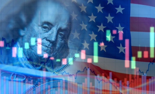 100 dollar bill superimposed with the American flag and bar graphs