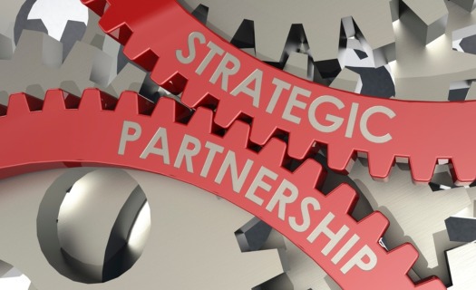 Gears with the words Strategic and Partnership printed on them.
