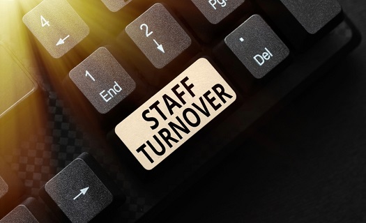 Computer keyboard with a button that says STAFF TURNOVER near another key that says END.