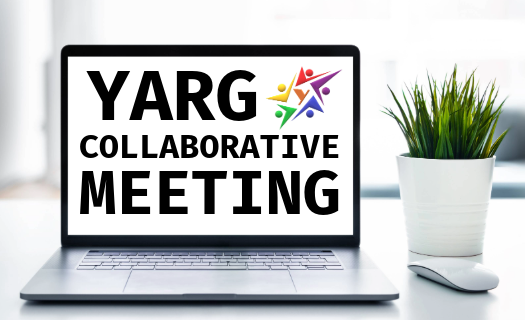 A laptop on a desk displaying the YARG logo and the text YARG Collaborative Meeting