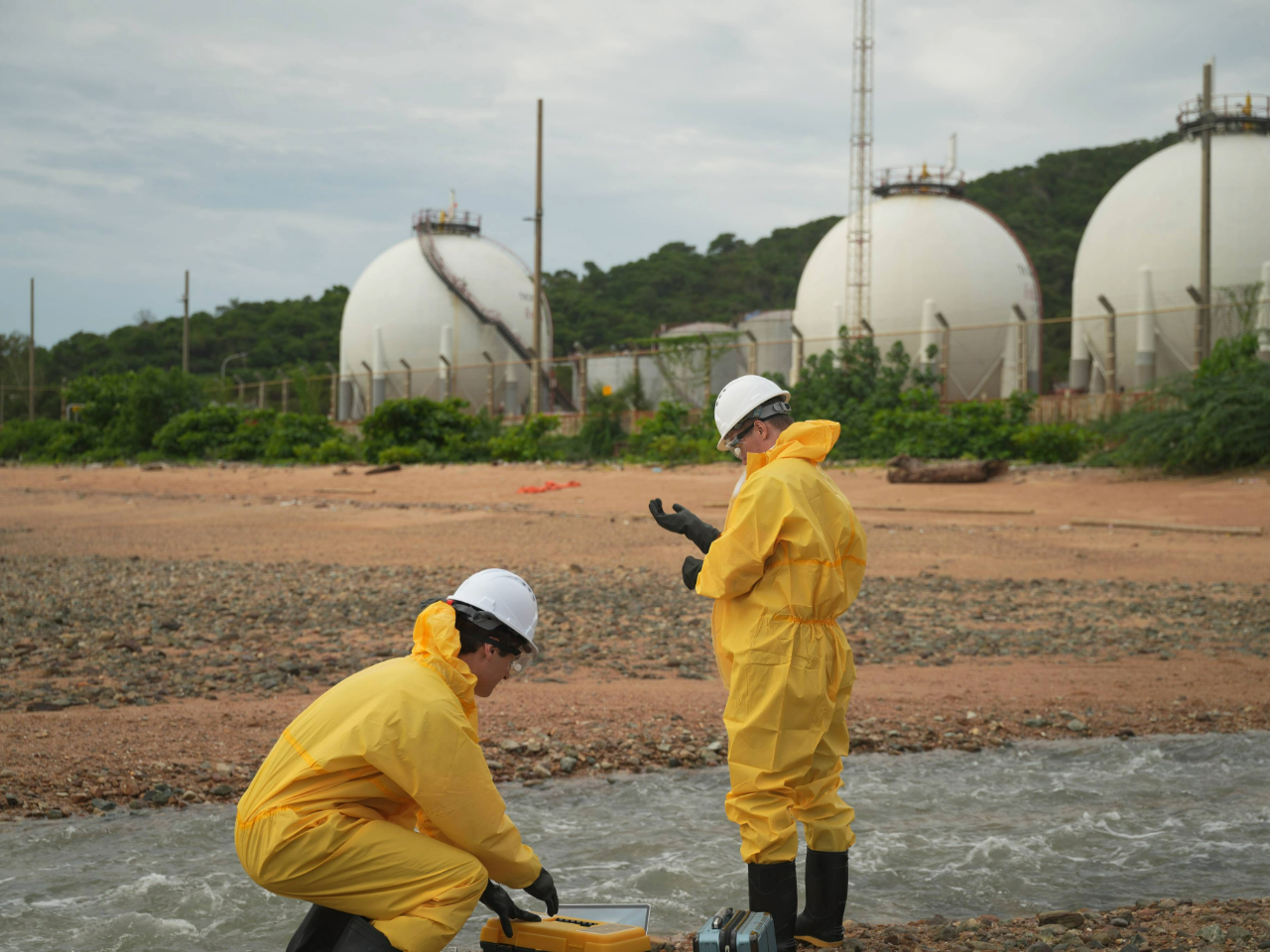 Creek Workers in yellow HAZMAT suits