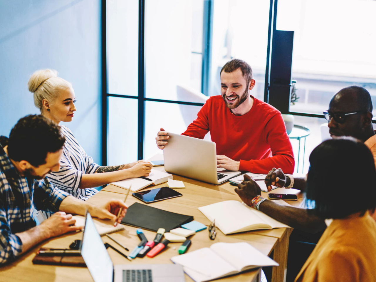 Adult learners sitting at a table