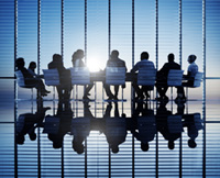Group sitting around conference table graphic