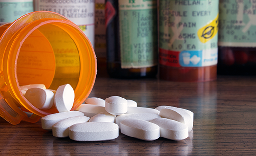 Prescription-pills-spilled-table.png