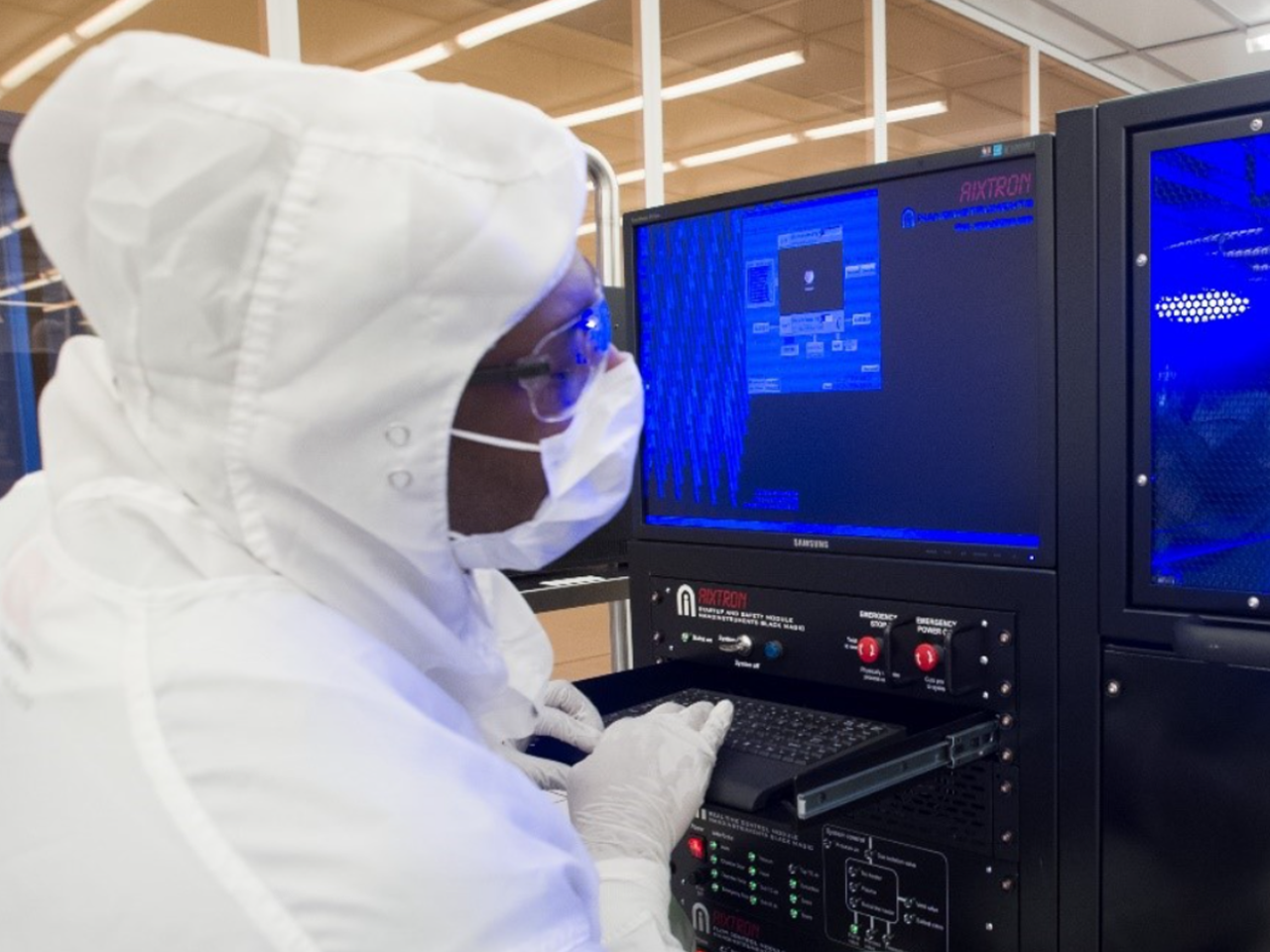 Engineer working at computer consoles