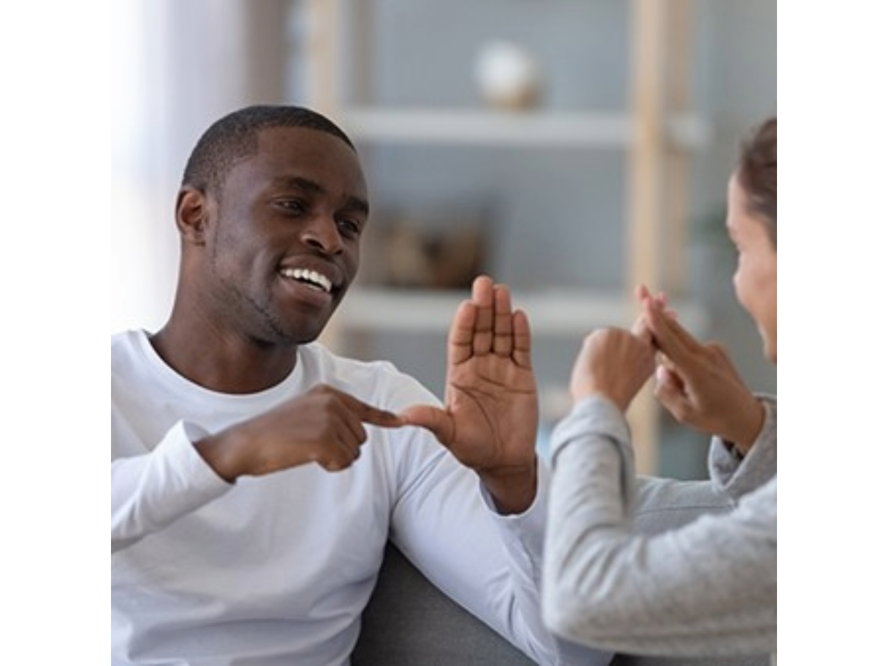 Man and woman communicating in sign language